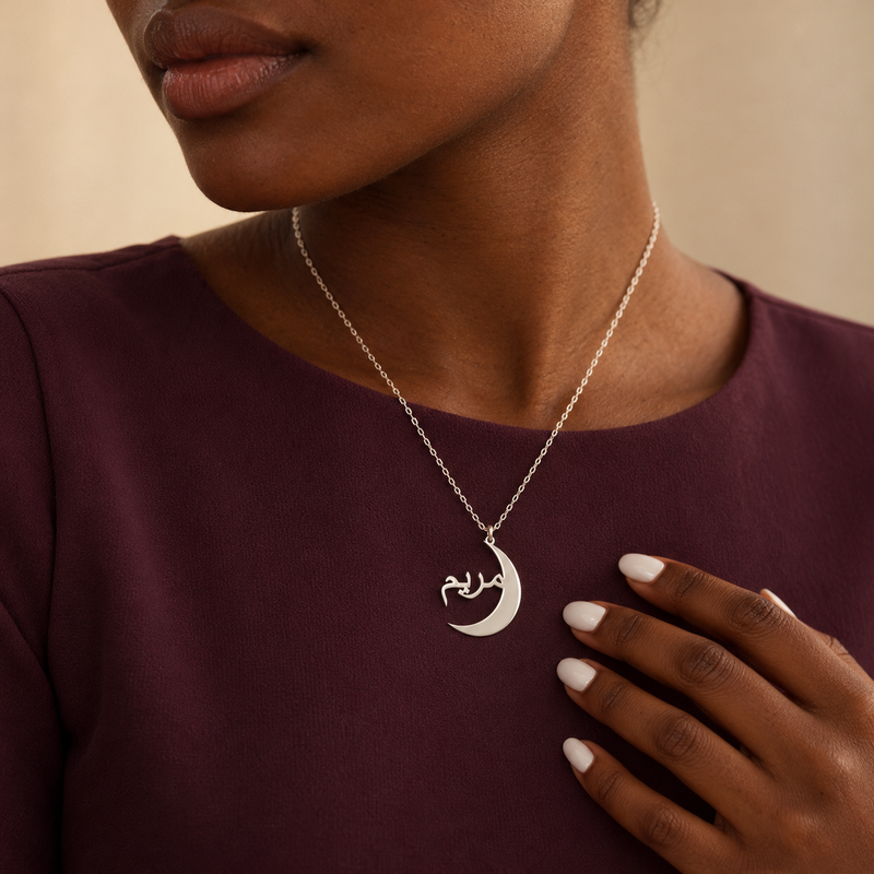 Woman wearing the silver crescent name necklace