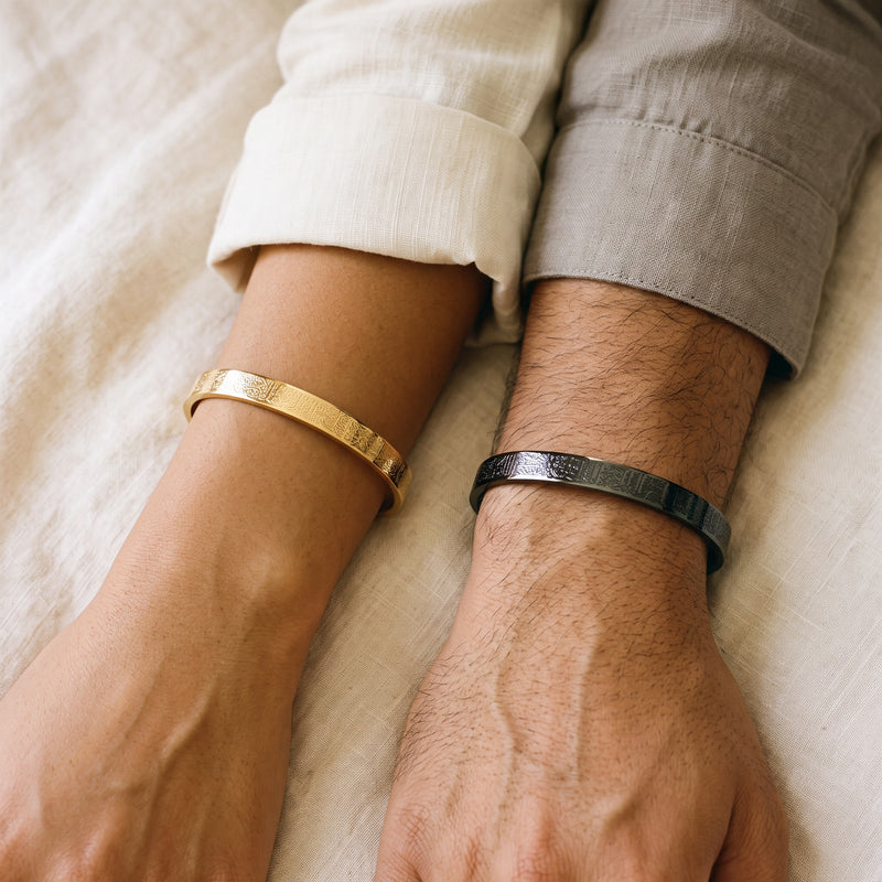 Matching Calligraphy His & Hers cuffs worn, gold and black