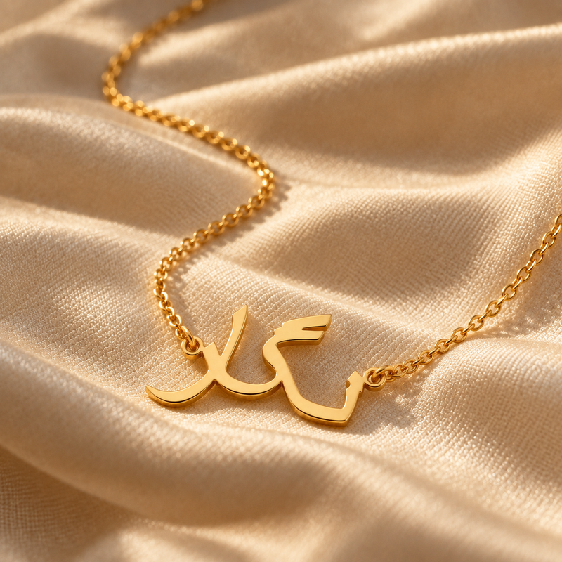 Farsi name necklace in gold on champagne silk