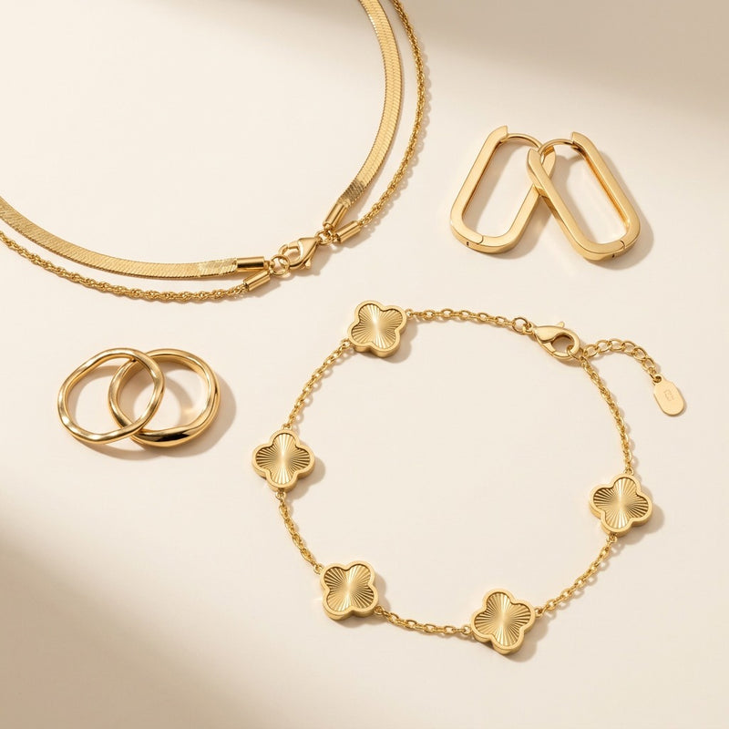 Rawdat Al-Qalb Bracelet in the foreground with the Noor Luna Chain and Minimal Square Hoops