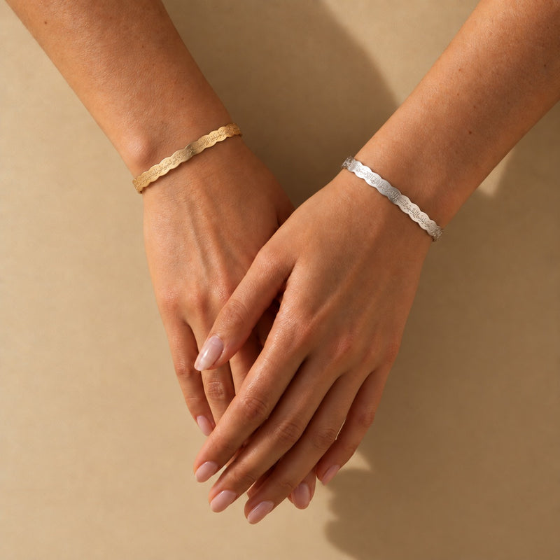 Ripple Calligraphy Cuff worn - gold and silver on two wrists