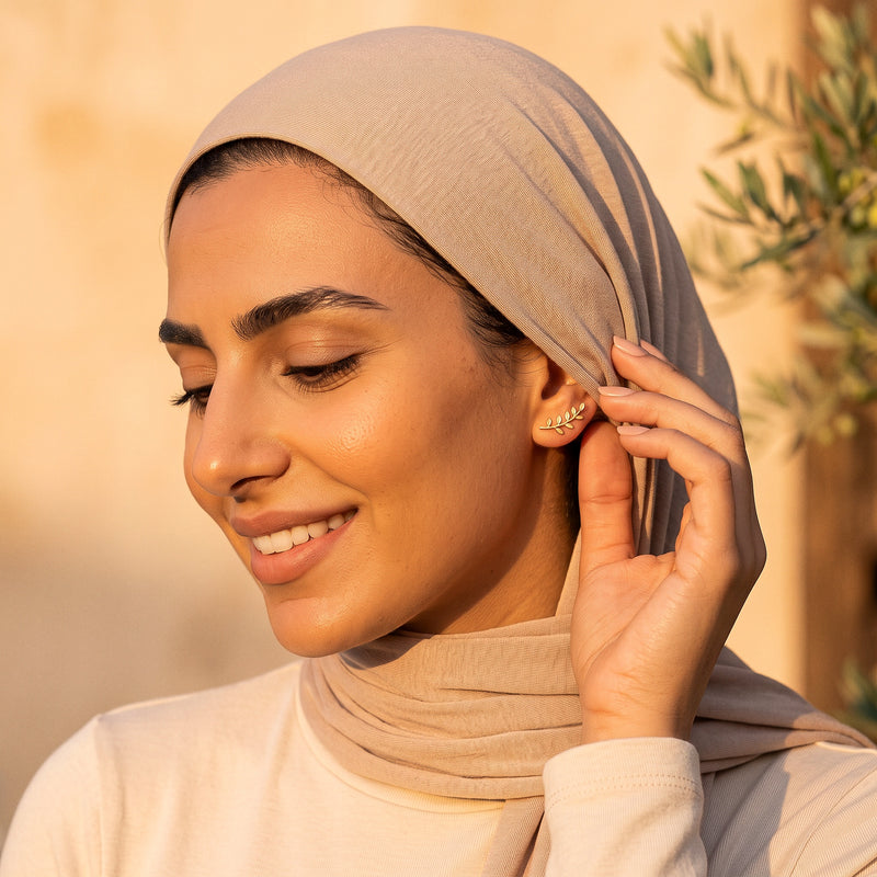 Olive Branch Earring worn with a hijab tucked behind the ear