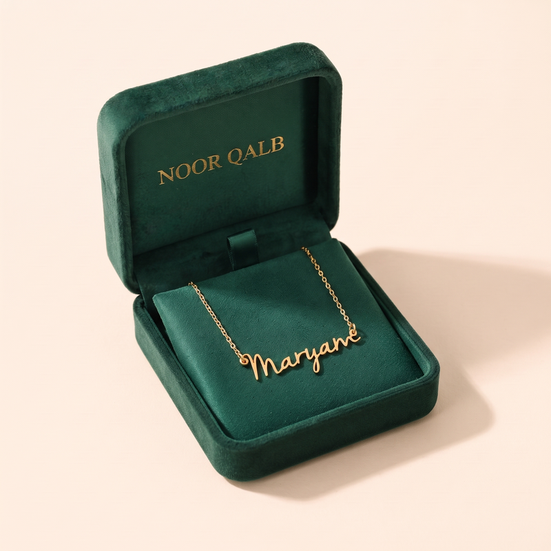 Signature name necklace in its Noor Qalb velvet gift box
