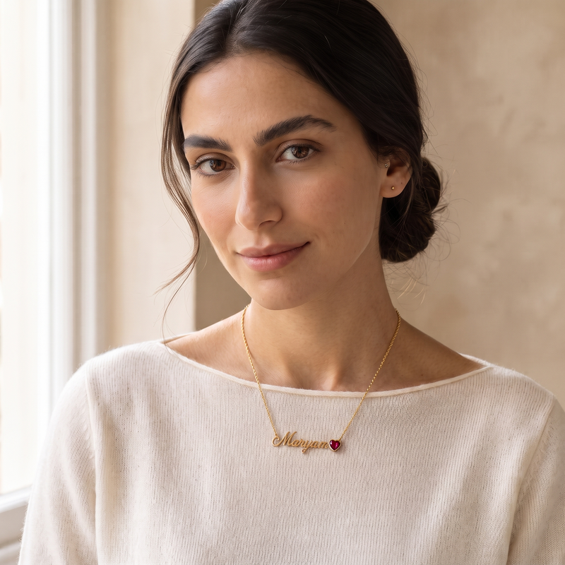 Personalised name necklace with July ruby birthstone, worn