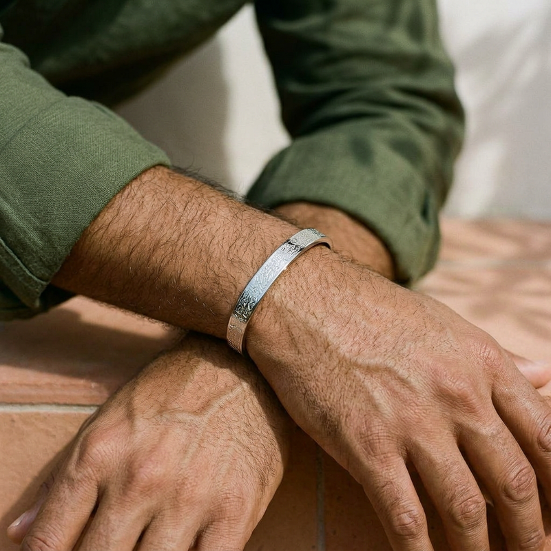 Ayatul Kursi Cuff for men worn, arms crossed - Silver finish