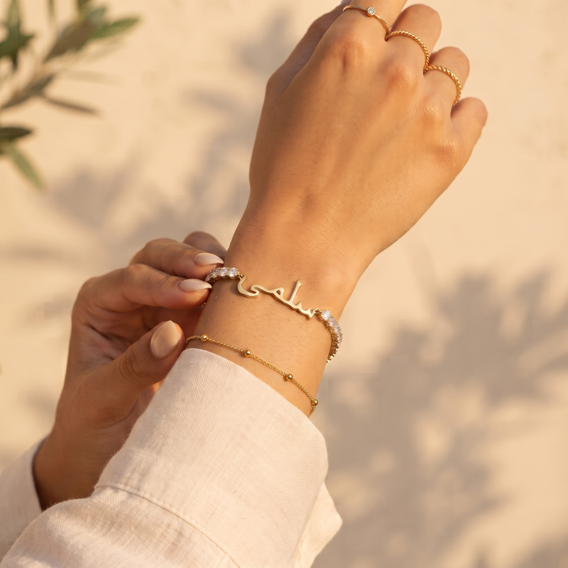 Arabic zircon name bracelet worn on the wrist, 18K gold