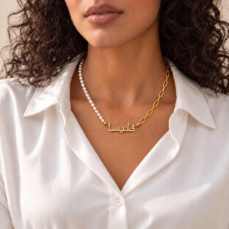 Pearl and paperclip name necklace worn with a shirt