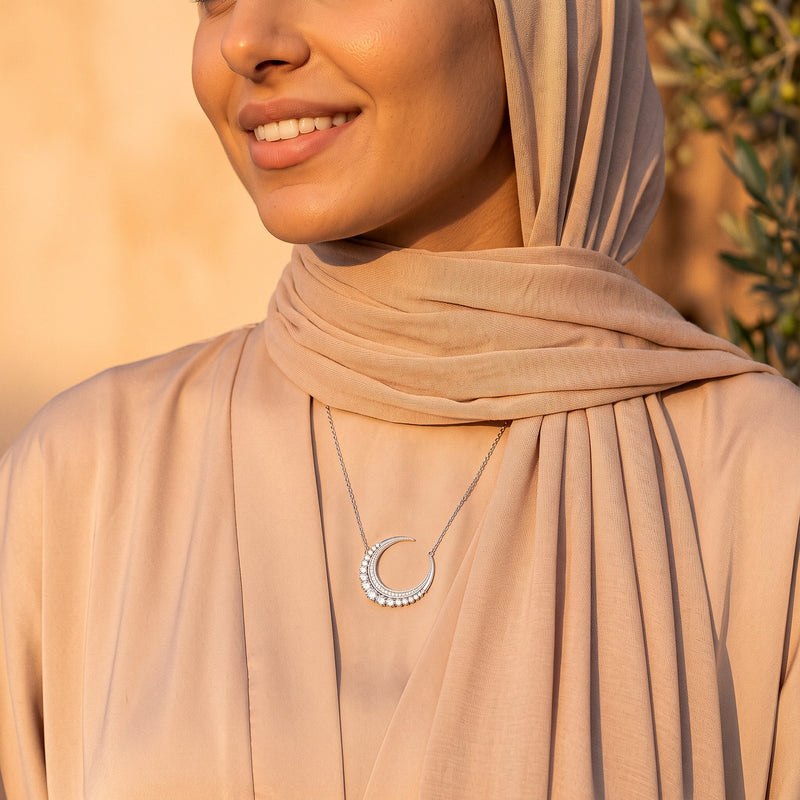 Hilal Al-Noor crescent moon necklace worn with a hijab