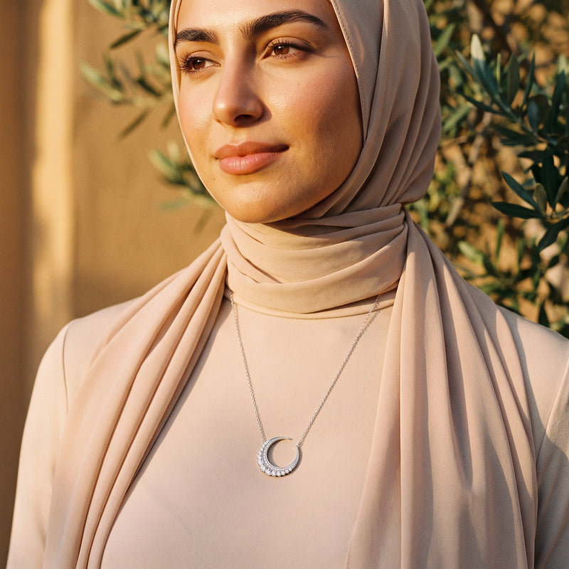 Hilal Al-Noor Pendant worn in warm golden light