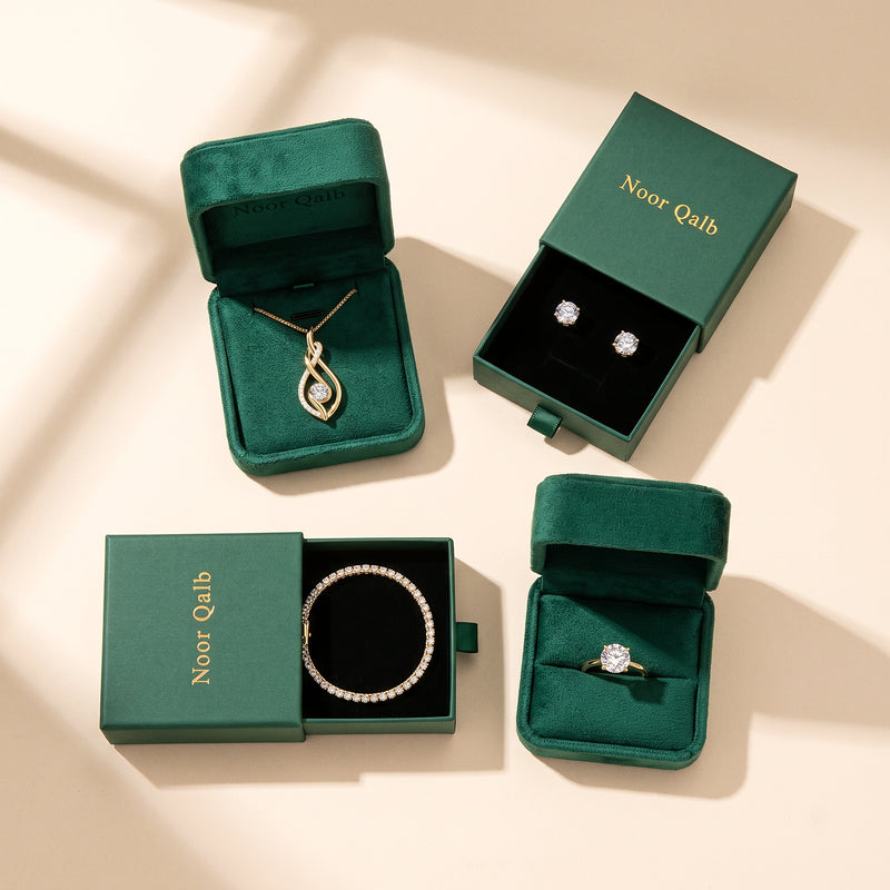 The Noor Moissanite Set - each piece in its own box: two emerald velvet boxes and two green Noor Qalb gift boxes