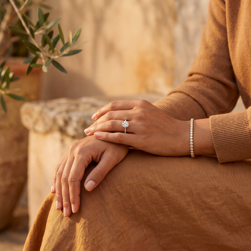 Noor Solitaire Ring and Moissanite Tennis Bracelet worn on the hand and wrist