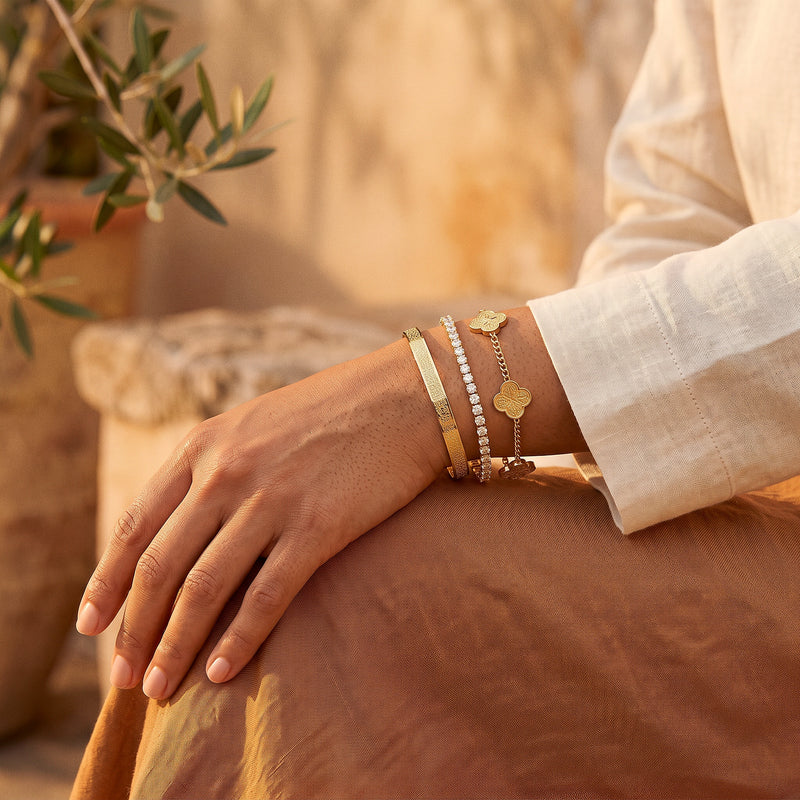 The three bracelets of the Noor Radiance Stack worn together