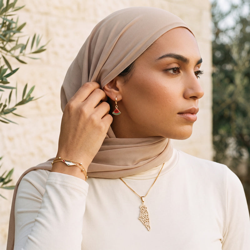 Palestine Essentials worn - watermelon hoop and map bracelet
