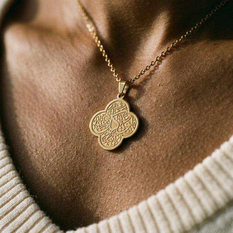 Rawdat Al Qalb Necklace worn - close-up of the engraved pendant